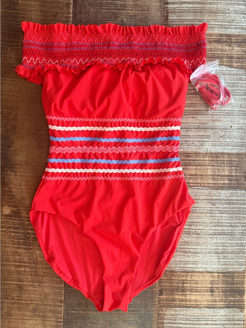 Red Carter womenโs Red Smocked One-Piece Swimsuit with Blue & White Striped Trim
